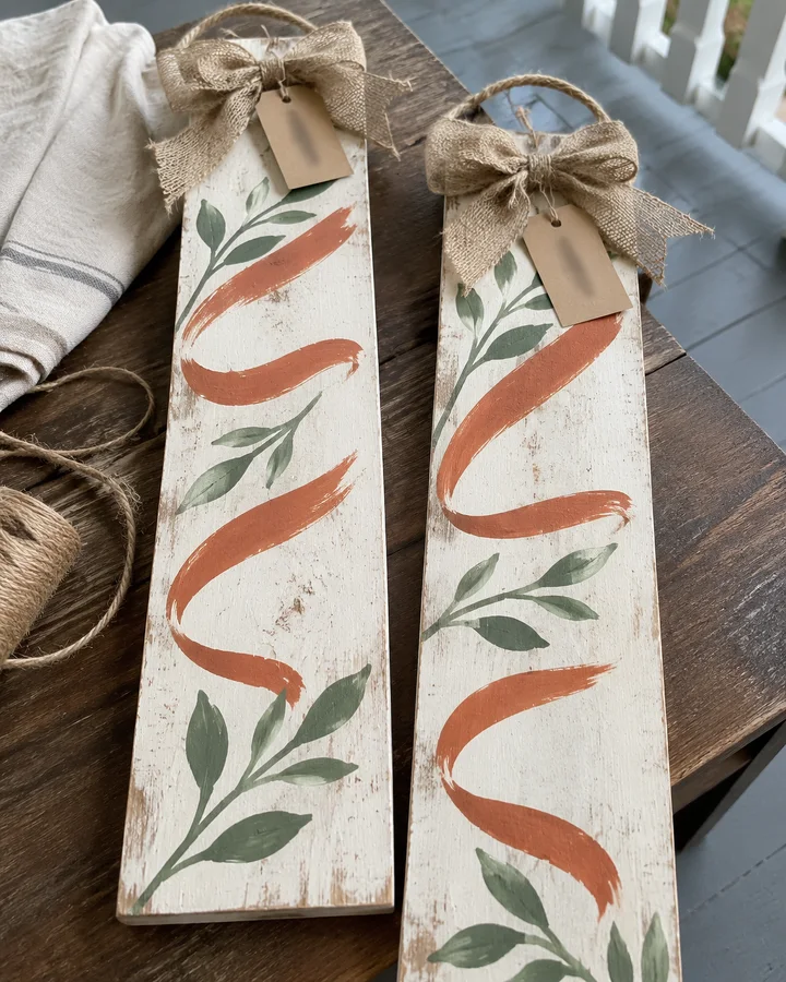 Rustic welcome door hangers on a porch with kraft price tags